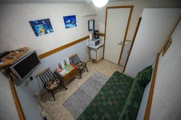 Фото номера Одноместный номер с общим душем и туалетом Дома для отпуска Holiday Village Kuukiuru г. Вуостимо 7